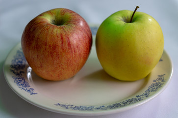 Different colored apples prepared to serve on the table