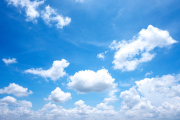 Naklejka na ściany i meble Beautiful white clouds with sun on blue sky.Color shade gradient from white to blue for background wallpaper.