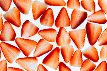 sliced fresh strawberries on white background