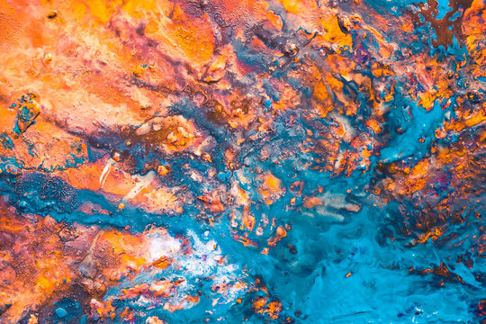 Abstract blue orange paint background. Rough uneven color blend texture surface. Acrylic painting art design technique.