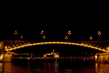 Budapest Hungary, 05.29.2019 luminous bridge Magrid across the Danube River. night Budapest glowing in gold