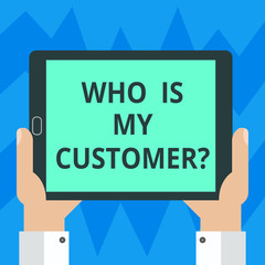 Text sign showing Who Is My Customer. Conceptual photo Know your clients get information of what they want Hu analysis Hand Holding Blank Screen Tablet Smartphone Display Unit photo