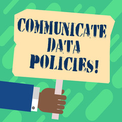 Handwriting text Communicate Data Policies. Concept meaning Protection of transmission of confidential data Hu analysis Hand Holding Blank Colored Placard with Stick photo Text Space