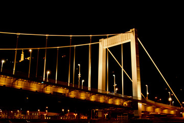 Budapest Hungary, 05.29.2019 glowing Erzhebet bridge across the Danube River. night Budapest glowing in gold