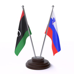 Libya and Slovenia, two table flags isolated on white background. 3d image