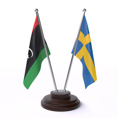 Libya and Sweden, two table flags isolated on white background. 3d image