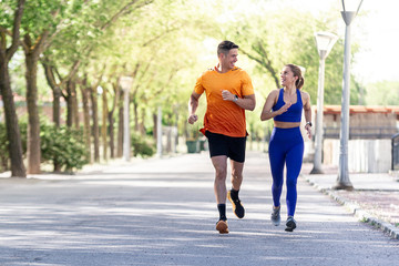 Fototapeta premium happy couple running on the park