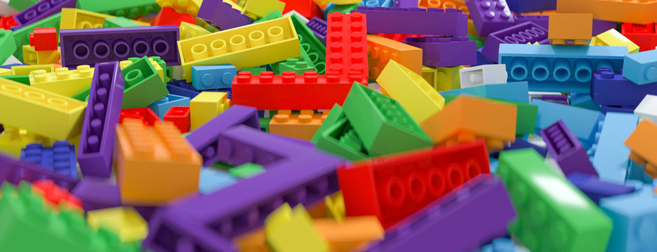 Colored Toy Bricks Background. Rainbow Colors. 3D Rendering