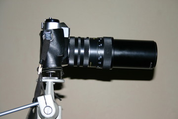 old movie camera on tripod
