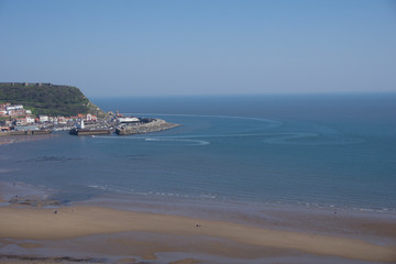 View from clifftops across the bay at Scarborough, Yorkshire, UK on a clear blue sky sunny day