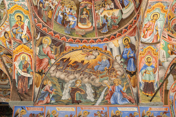 Religious frescoes on the treatises from the Bible, painted on the church wall in Rila Monastery,...