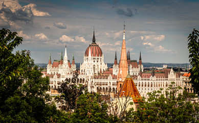 Obraz premium Building of the hungarian parliament in a Budapest, capital of Hungary, by the Danube river. One of the landmark of Budapest, and popular tourist destination.