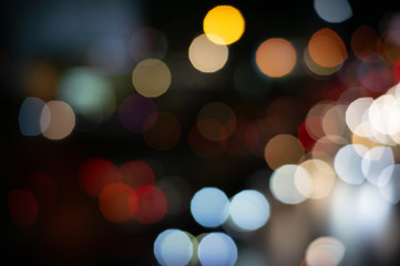 Fototapeta premium Bokeh night light on the avenue Light night at city blue bokeh sky festival abstract background blur lens flare reflection beautiful circle street with dark