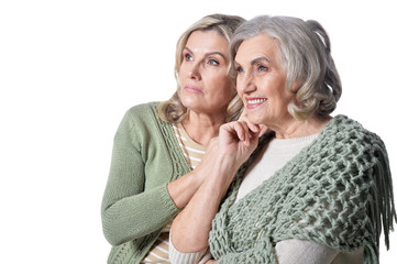 Portrait of two smiling women on white background