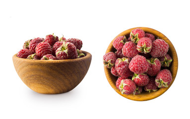 Raspberries in a wooden bowl isolated on white background. Raspberry closeup. Vegetarian or healthy eating. Juicy and delicious raspberries. Background of raspberries.  Red raspberries.