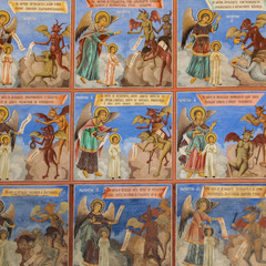 Fototapeta na wymiar Religious frescoes on the treatises from the Bible, painted on the church wall in Rila Monastery, Bulgaria