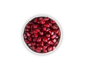 Top view. Pomegranate seeds isolated on white. Background made of red pomegranate seeds. Garnet with copy space for text. Top view. Pomegranate isolated on white background. Garnets isolated on white.