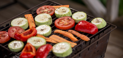 Grill party in a garden.  Healthy food preparing outdoors on summer or spring picnic.