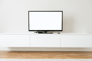 Mock up Smart TV with white screen standing in white living room