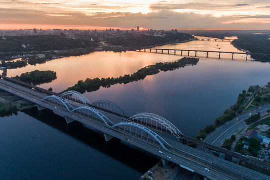 Sunset aerial view on a Darnitsky Bridge in Kyiv, Ukraine