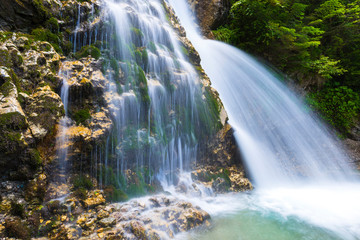 Fototapeta na wymiar Amazing waterfall in Bucegi Mountaiuns, Urlatoarea waterfall