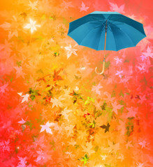 Turquoise umbrella on multicolored defocused autumn background.