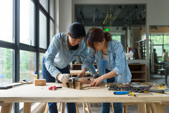 Female carpenter working in studio