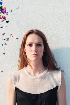 Serious woman and confetti