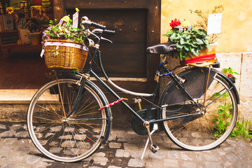 Fototapeta na wymiar Bicycle with flowers on the street