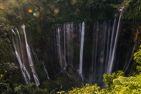 huge waterfall in deep green jungle landscape