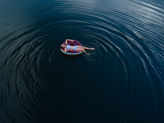 teen floating on the water