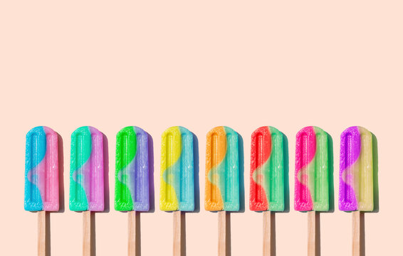Row of rainbow-colored icecream lollies