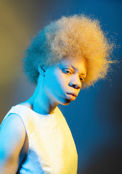 Portrait of girl with yellow and blue lights