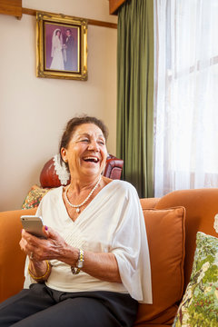 Senior Hispanic Woman Using Cell Phone