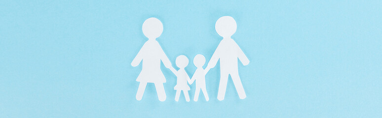 top view of white decorative paper cut family on blue background, panoramic shot