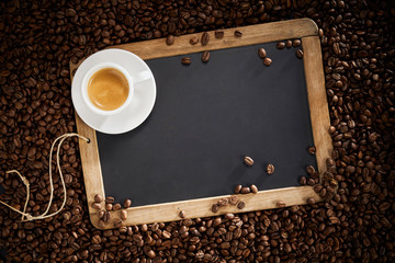Blank school slate with cup of espresso coffee