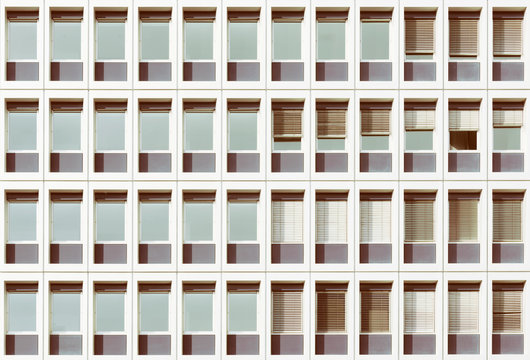 Windows of apartment block creating repetitive pattern