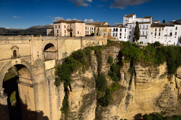 Fototapeta na wymiar Cliff at El Tajo Canyon on the Guadalevin river with 18th century new bridge at Ronda Spain