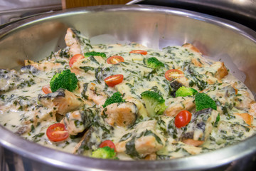cooked fish with butter sauce in dish