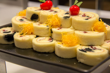  blueberry cake roll on black plate