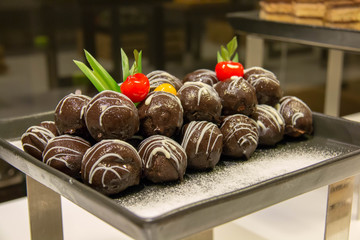  dark chocolate ball on plate in buffet