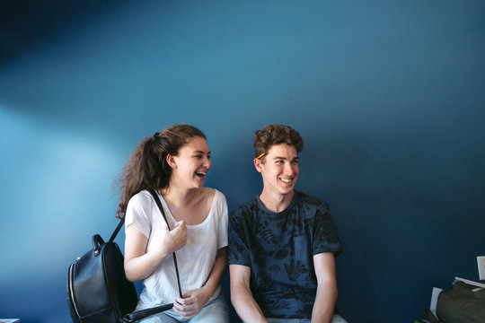 Teenage couple sitting together