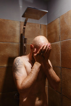 Hairless Man Washing In Shower