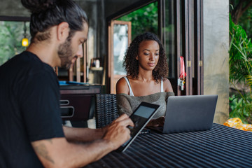 Digital nomads working in a cafe
