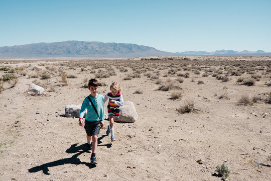 two kids running back