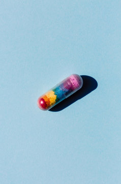 Pill that makes people feel better on a baby blue background