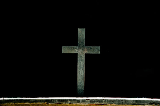 Bright Jesus Christ cross religion symbol on black background