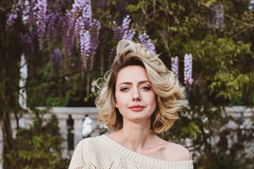 Portrait of attractive blonde woman looking at camera