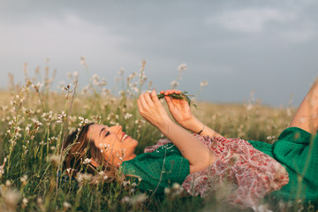 Portraits of woman celebrating spring at nature fields.