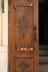 Baku, Azerbaijan - 06.25.2018: Design of the door in the form of a backgammon board in the old town of Icheri Sheher.